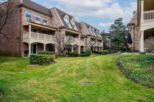 view of yard with a balcony