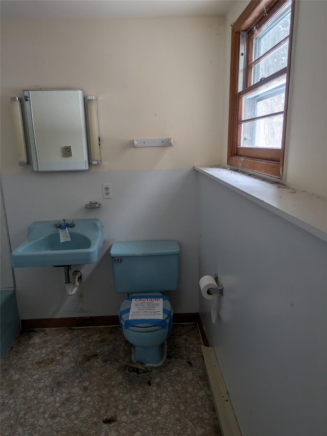 bathroom featuring sink and toilet