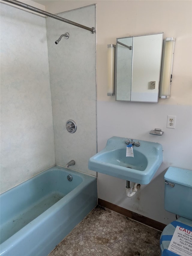 bathroom with shower / tub combination and sink