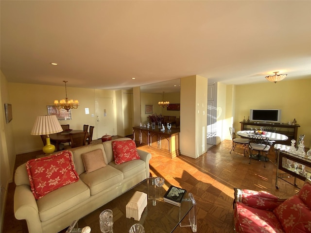 living room with parquet flooring and an inviting chandelier