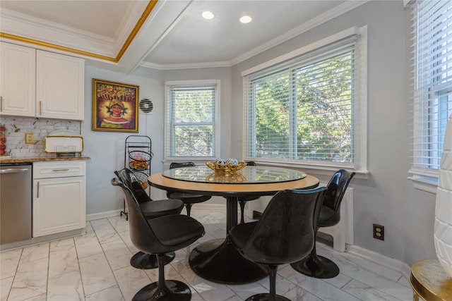 dining area with plenty of natural light and ornamental molding