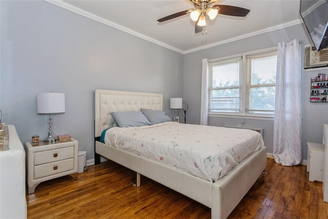 bedroom featuring ceiling fan, ornamental molding, and dark wood-type flooring