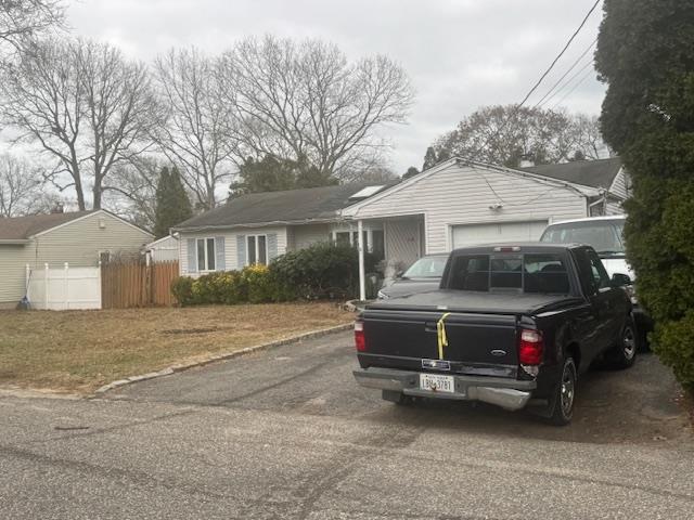 single story home with a garage