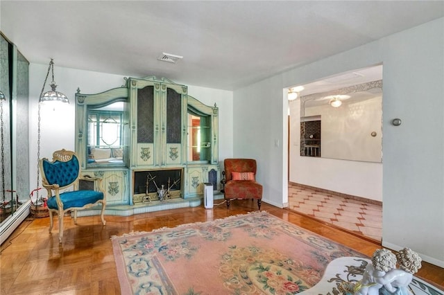 sitting room with parquet flooring