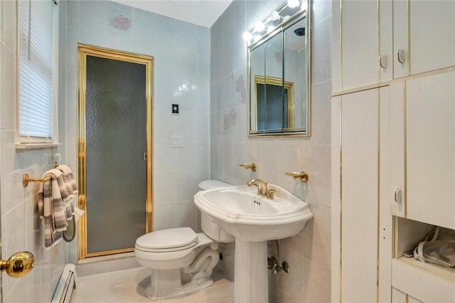 bathroom featuring tile patterned flooring, a baseboard heating unit, toilet, a shower with shower door, and tile walls