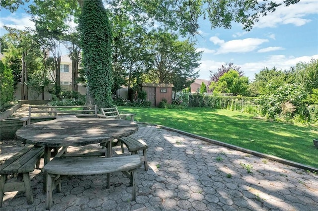 view of patio / terrace featuring a storage unit