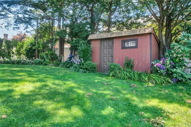 view of outbuilding with a lawn