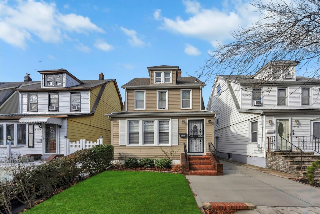 view of front of house with a front lawn