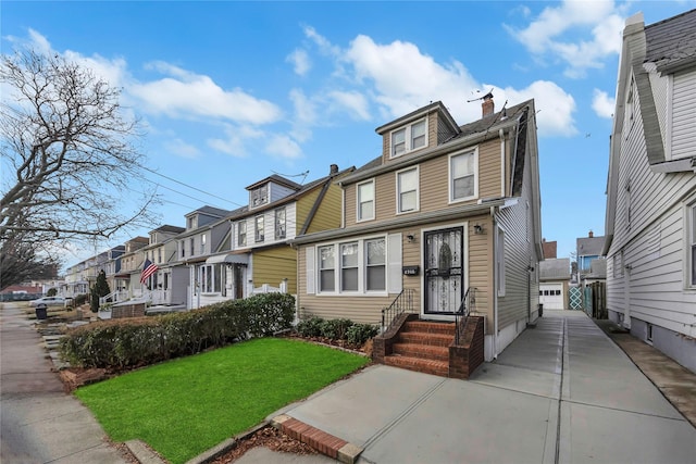 view of front of home with a front lawn