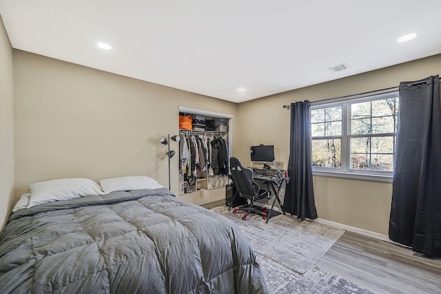 bedroom featuring a closet and wood-type flooring