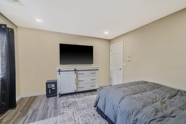 bedroom featuring hardwood / wood-style floors