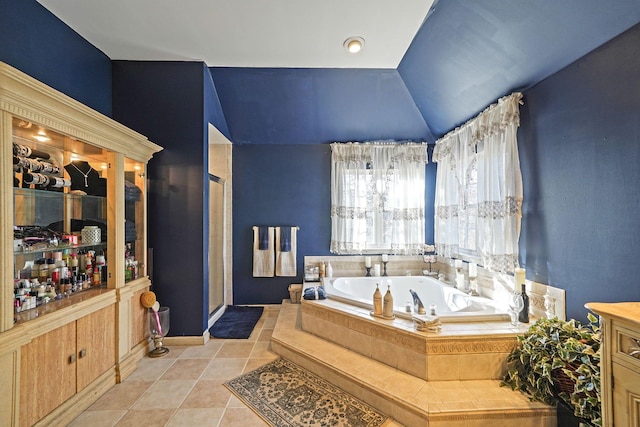 bathroom featuring tile patterned floors and shower with separate bathtub