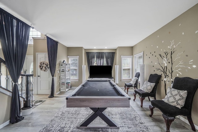 playroom featuring light hardwood / wood-style flooring, a healthy amount of sunlight, and billiards