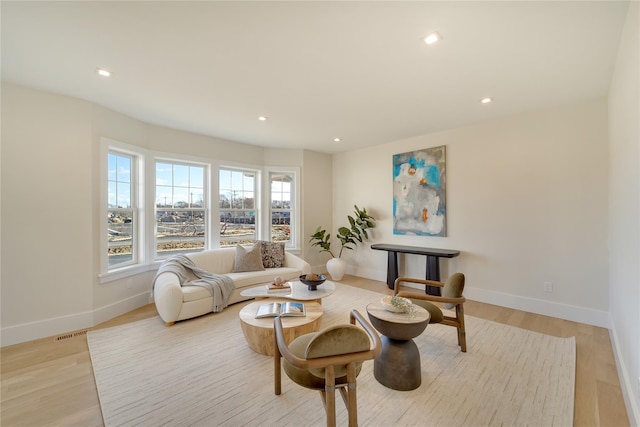 living room with light hardwood / wood-style floors