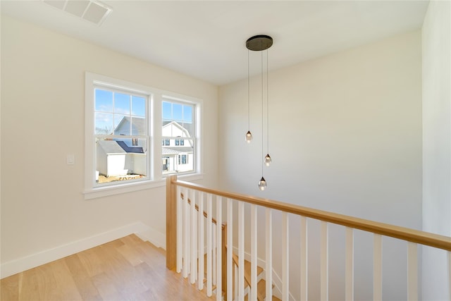 corridor featuring hardwood / wood-style flooring