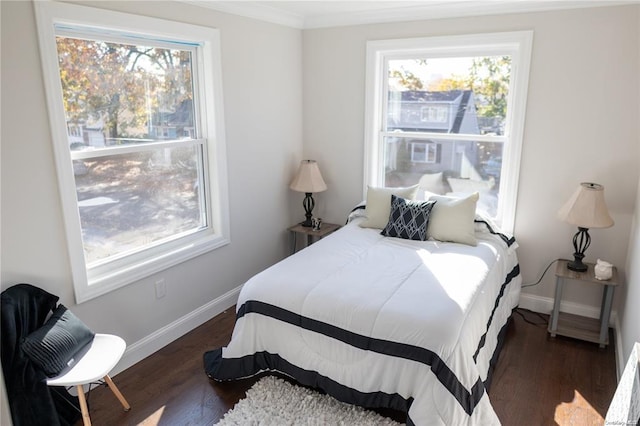 bedroom featuring dark hardwood / wood-style floors and ornamental molding