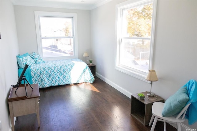 bedroom featuring dark hardwood / wood-style flooring and ornamental molding