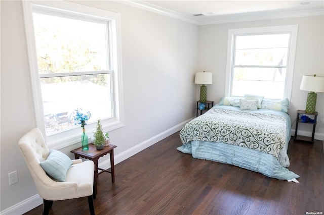 bedroom with dark hardwood / wood-style floors and ornamental molding