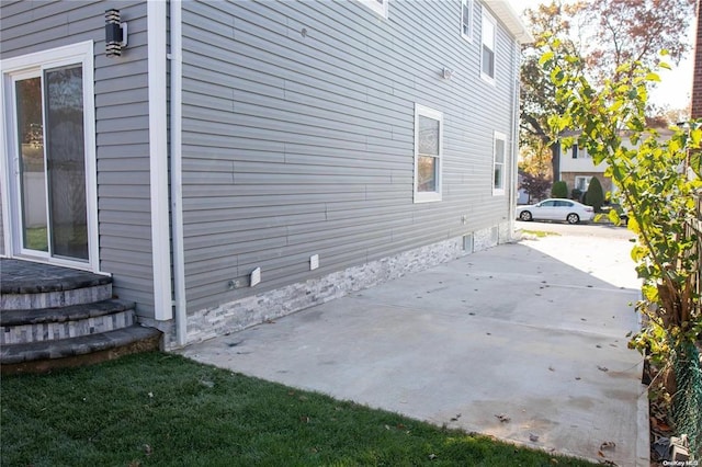 view of property exterior featuring a patio area