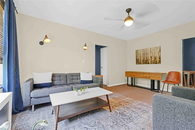 living room featuring ceiling fan and carpet