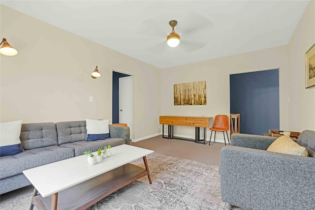 carpeted living room with ceiling fan