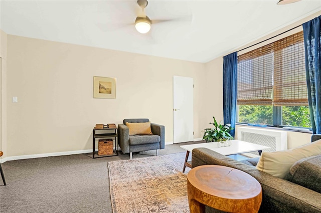 living area with carpet flooring, radiator, and ceiling fan