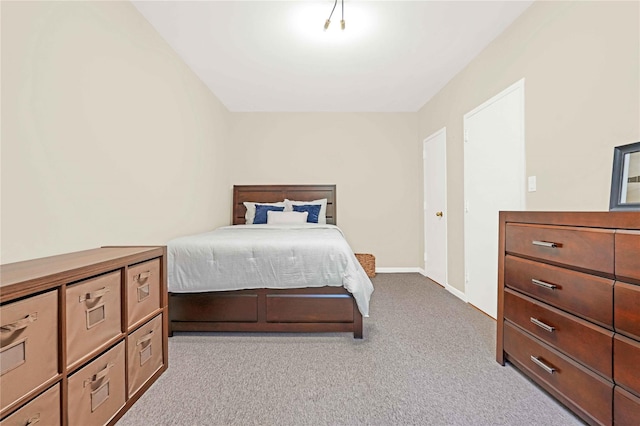 bedroom with light colored carpet