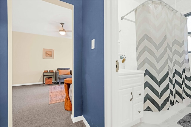 bathroom with a shower with curtain and ceiling fan