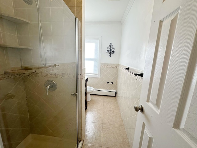 bathroom featuring a baseboard radiator, tile patterned flooring, crown molding, an enclosed shower, and tile walls