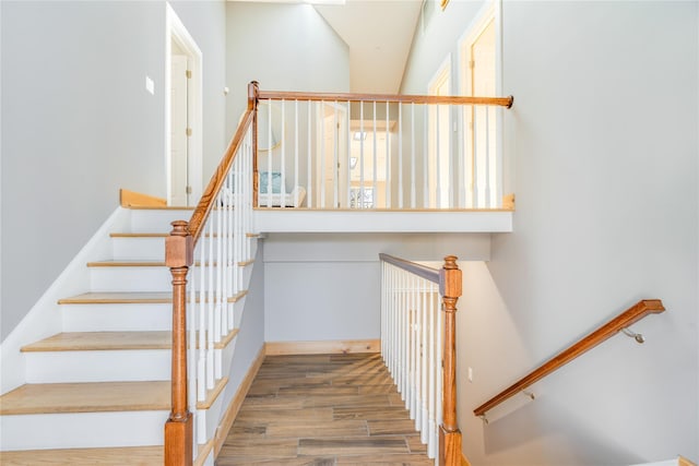 staircase featuring hardwood / wood-style flooring