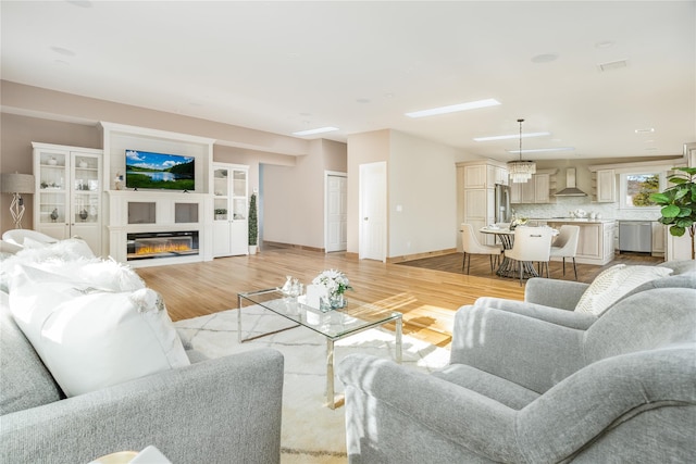 living room with light hardwood / wood-style flooring