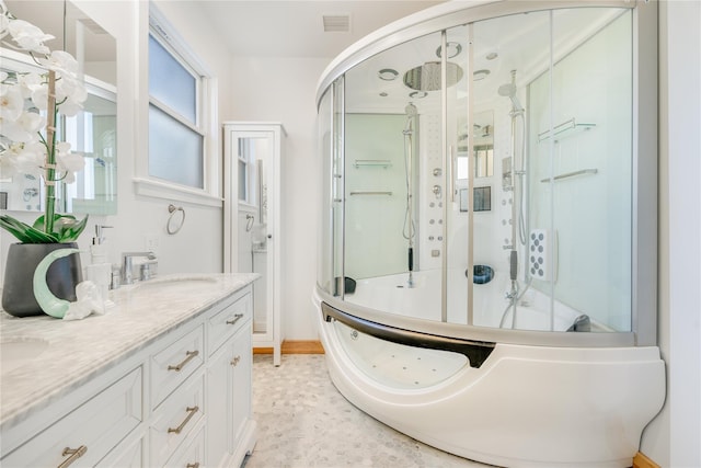 bathroom with vanity and a shower with shower door