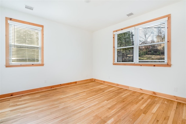 unfurnished room featuring light wood-type flooring