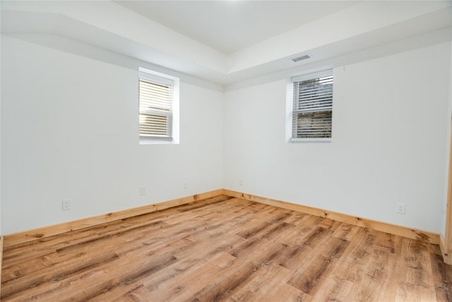 unfurnished room featuring hardwood / wood-style flooring