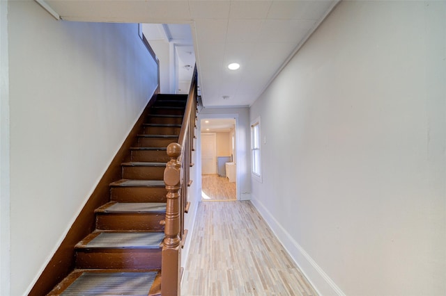 stairway with hardwood / wood-style floors