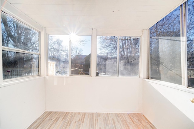 unfurnished sunroom with plenty of natural light