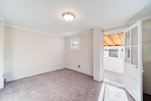 carpeted empty room with ornamental molding