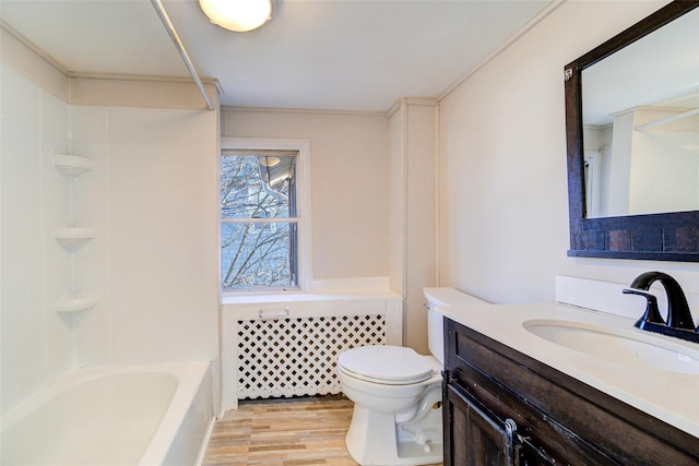 full bathroom with hardwood / wood-style floors, vanity, toilet, and shower / washtub combination