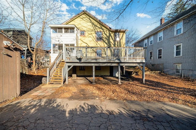 back of property with a wooden deck