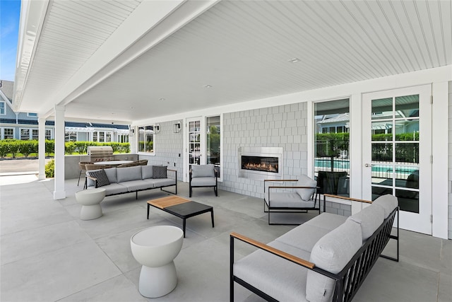 12 Depot Road 1302 (Pearl Way), Westhampton Beach, NY 11978 - view of patio featuring an outdoor living space with a fireplace