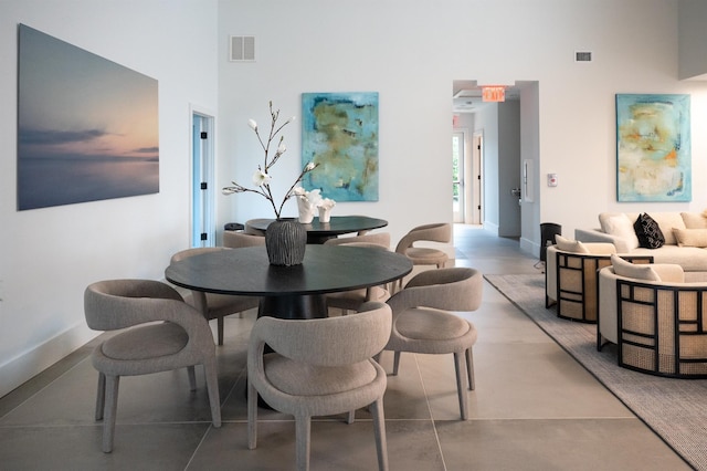 12 Depot Road 1302 (Pearl Way), Westhampton Beach, NY 11978 - dining space featuring a high ceiling