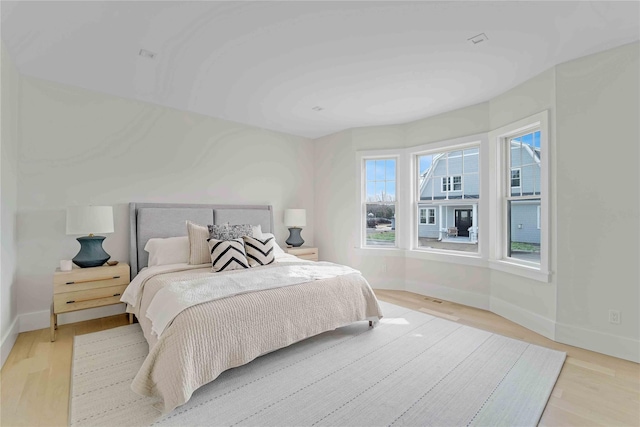 12 Depot Road 1302 (Pearl Way), Westhampton Beach, NY 11978 - bedroom with baseboards and light wood-type flooring