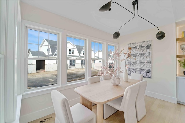 12 Depot Road 1302 (Pearl Way), Westhampton Beach, NY 11978 - dining space with baseboards and light wood finished floors