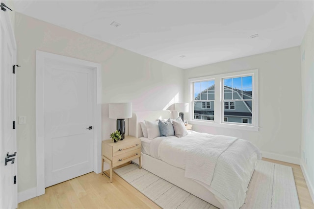12 Depot Road 1302 (Pearl Way), Westhampton Beach, NY 11978 - bedroom featuring light wood-style flooring and baseboards