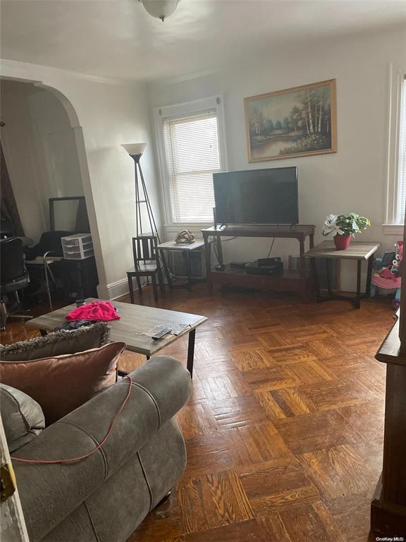 living room with dark parquet flooring