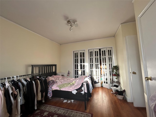 bedroom featuring hardwood / wood-style floors and french doors