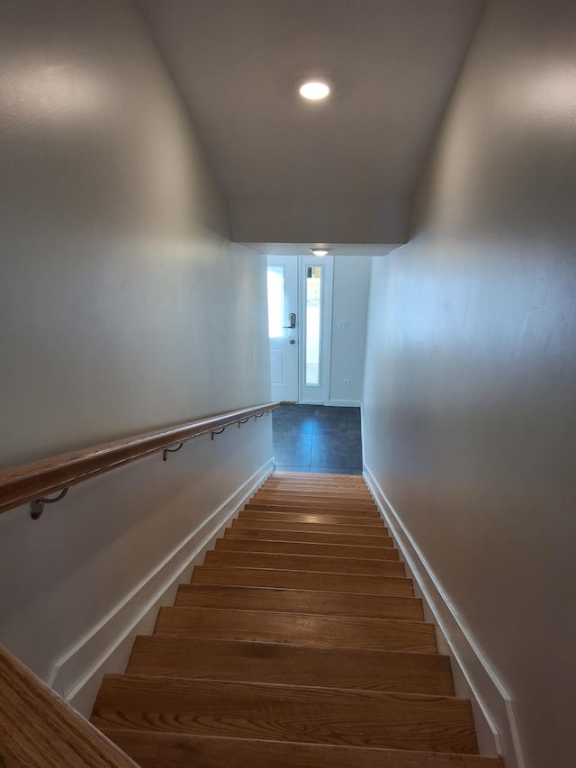 stairway featuring hardwood / wood-style floors