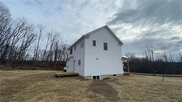 view of home's exterior with a deck