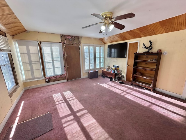 interior space featuring ceiling fan, wooden ceiling, carpet floors, and lofted ceiling