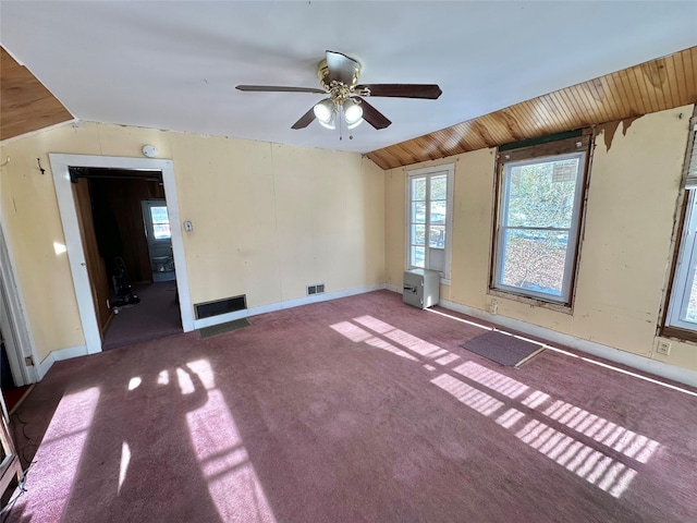 carpeted empty room with ceiling fan, lofted ceiling, and wooden ceiling